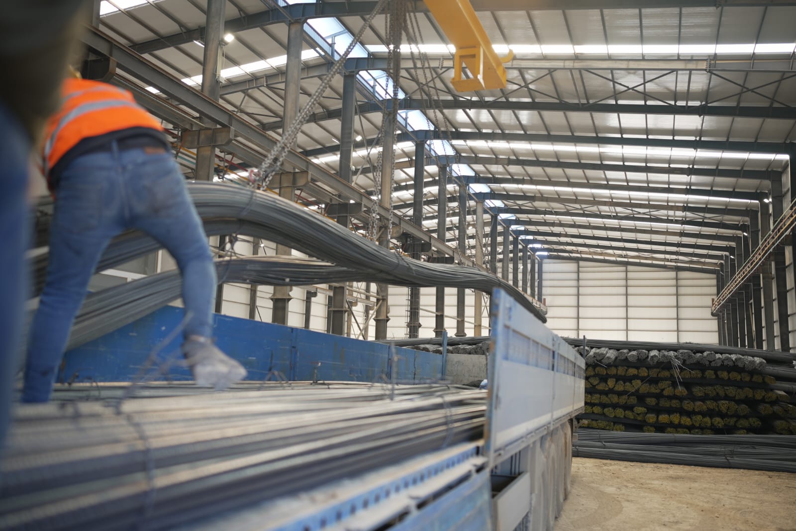 Rebar strands being lowered onto a delivery truck