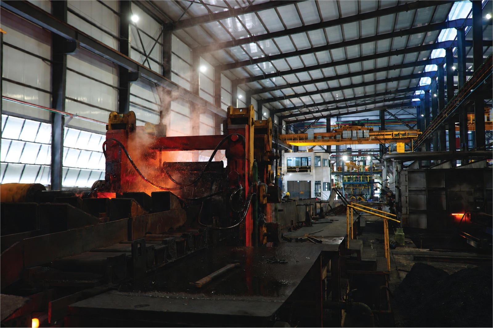 Rebar coils moving through the rolling mill